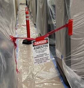 asbestos abatement coverings in office space with cubicles